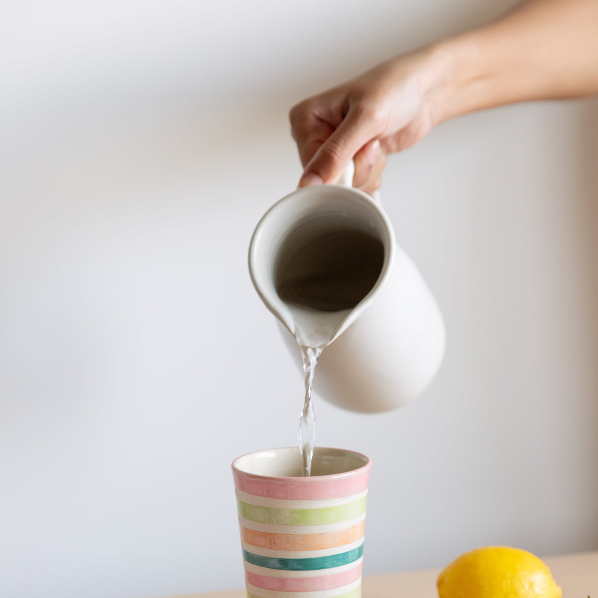 White ceramic pitcher, pourer, jug