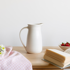 White ceramic pitcher, pourer, jug